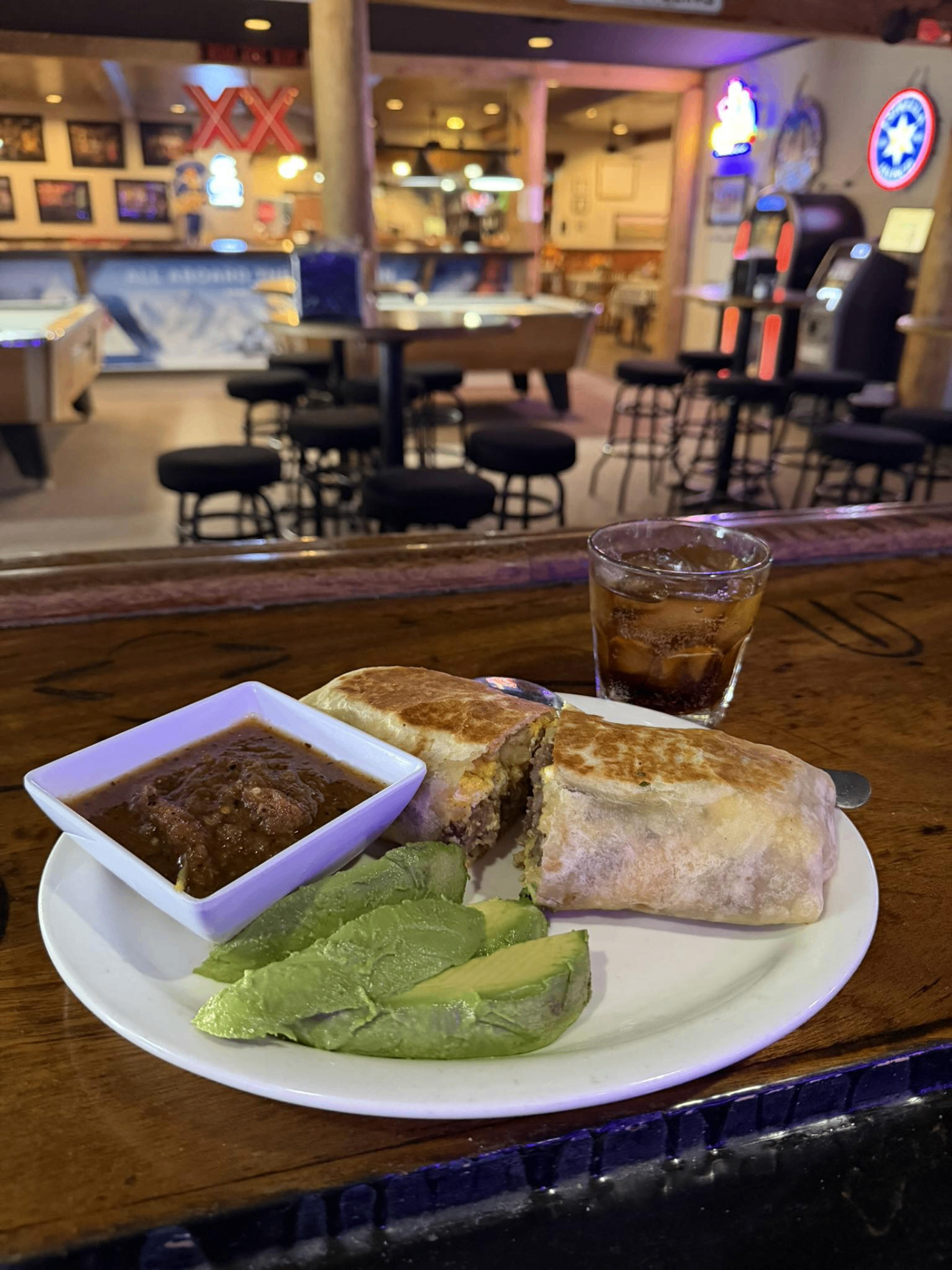 Breakfast burrito and cocktail served at the Desert Rose Bar & Grill bar in Arlington, Arizona